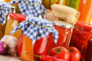 Composition with jars of pickled vegetables. Marinated food